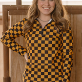 Gold and black checkered pullover with collared neckline, quarter-zip front, and kangaroo pocket, laid flat to highlight bold colors and design.