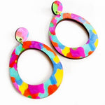 Colorful oval earrings on a white background
