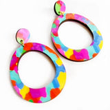 Colorful oval earrings on a white background