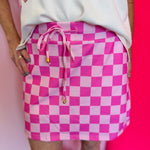 Pink checkered skort with elastic waist and gold tipped drawstring