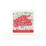 A festive soap-infused sponge, featuring a holiday-themed label that says "FaLaLa Tis the Season."