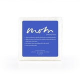 A soap-infused sponge with the word "Mom" on top.