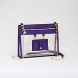 Clear crossbody bag with vibrant purple trim and gold hardware, featuring a detachable sunglasses holder—fun and functional for any event.