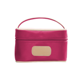 A Berry colored Jon Hart mini makeup case with natural leather trim and a leather patch for personalization.