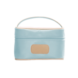 An ice blue colored Jon Hart mini makeup case with natural leather trim and a leather patch for personalization.