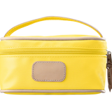 A lemon yellow colored Jon Hart mini makeup case with natural leather trim and a leather patch for personalization.