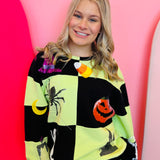 Green and black checkered Halloween sweatshirt with rhinestone and sequin Halloween motif.
