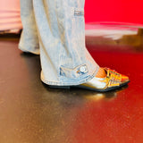 Close-up of the bottom hem of the Jovie jeans showing subtle button detailing.