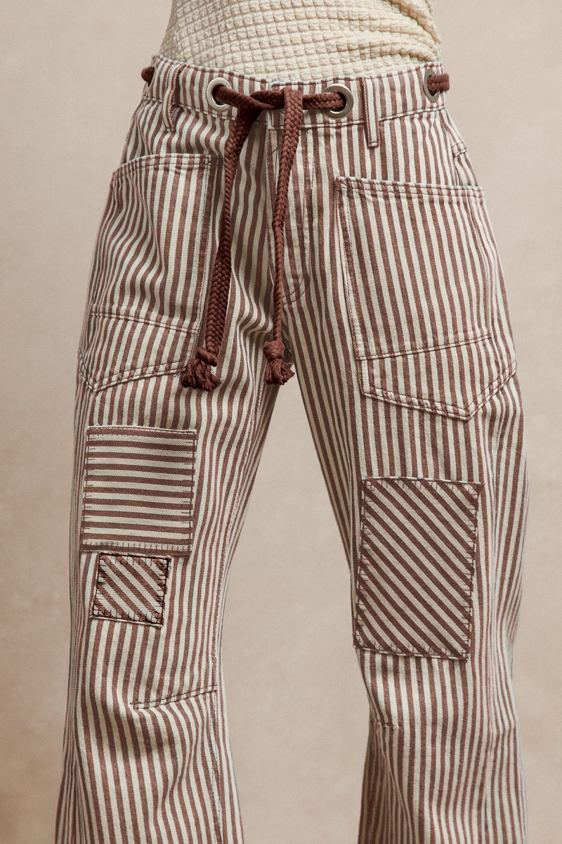 Mocha striped barrel jeans with patches and corded belt.