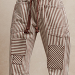 Mocha striped barrel jeans with patches and corded belt.