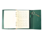 Calendar in green clutch folio journal with calender and matching pen. 'FUCK IT UP' gold foil text.