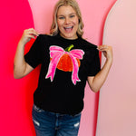 Black tee with sequin orange pumpkin graphic and bright pink sequin bow.