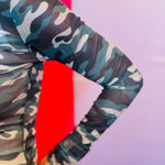 Close-up of the sleeve on the Keigan Mesh Top showing the green camo print, soft stretch mesh fabric, and delicate lettuce-edge hem detail.