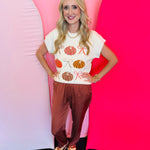 Lightweight knit sweater with rows of colorful pumpkins on a neutral base.