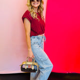 Side view of the full outfit highlighting the side design and large panel pockets on the Jovie Tie Waist Jeans.