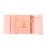 Inside view of pink magnetic closure journal folio and calendar with gold graphics.