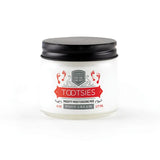 A 6oz glass jar of "Tootsies" therapeutic foot cream, with a small swatch of the cream.