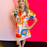 Full-body view of the Sicily Calls Dress highlighting its flattering shift silhouette, collared neckline, and colorful summer-themed pattern—perfect for warm-weather outings.