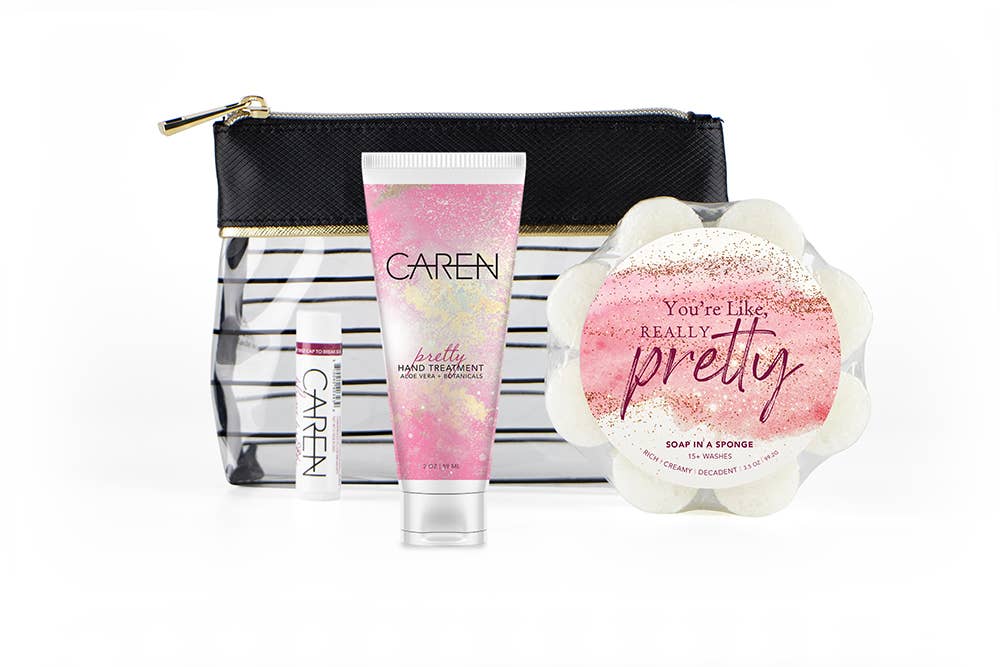 A gift set in a cosmetic bag, including "Pretty" hand cream, a soap sponge, and a lip balm.