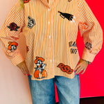 Close up of Queen Of Sparkles orange and white striped icon Oklahoma State University game day blouse.
