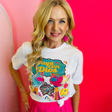 Close-up of the Vaya Con Dios Tee highlighting the colorful floral design and sparkling rhinestone details on the white cotton fabric.