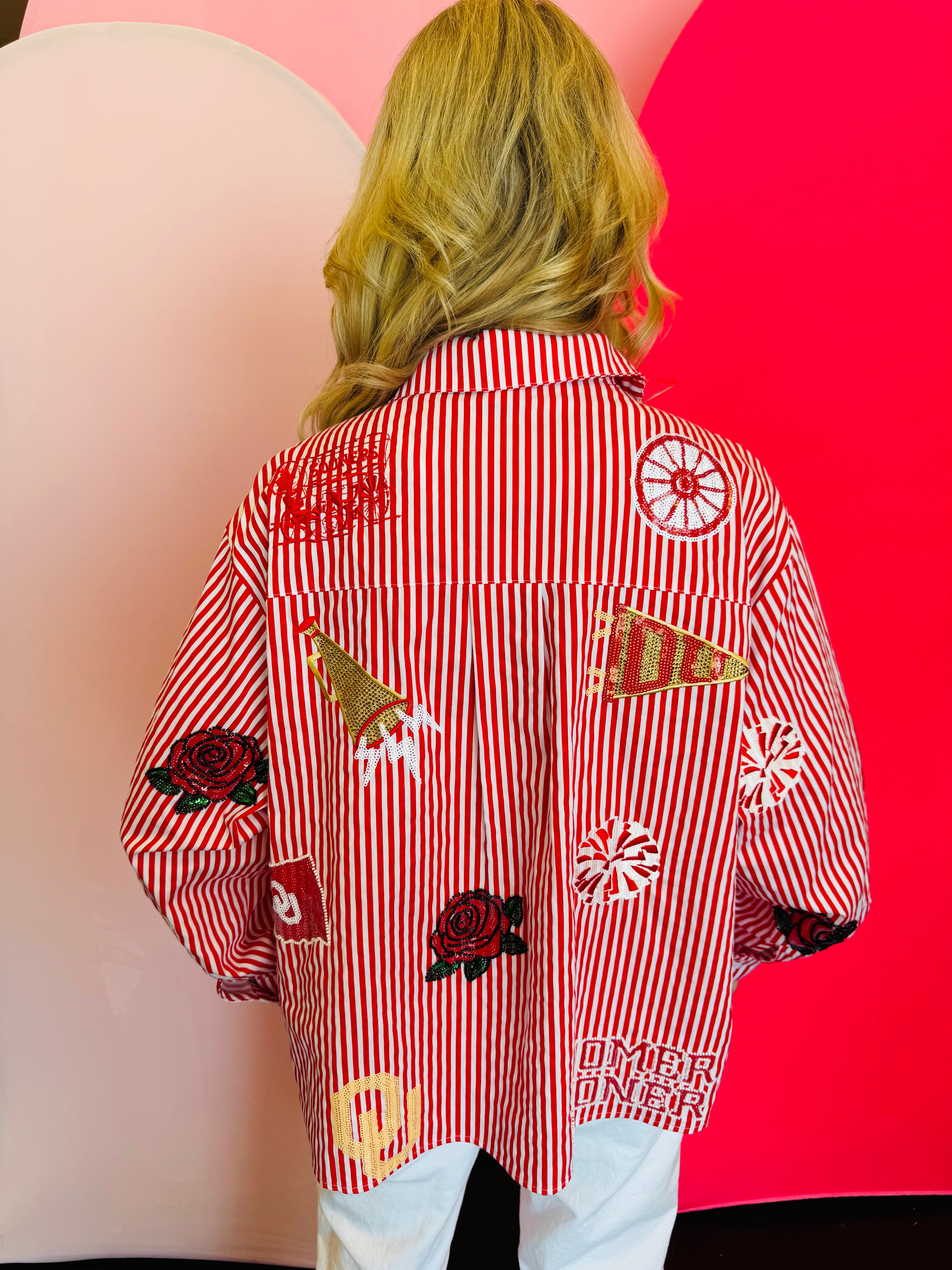 Back side of Queen Of Sparkles crimson red and white stripe icon University Of Oklahoma game day blouse.