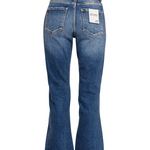Mid-rise distressed denim pants with knee slits and raw hem; light wash with stretch fit shown on model.