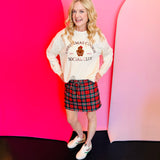Red tartan Christmas skort with drawstring waist, pockets, and built-in shorts.