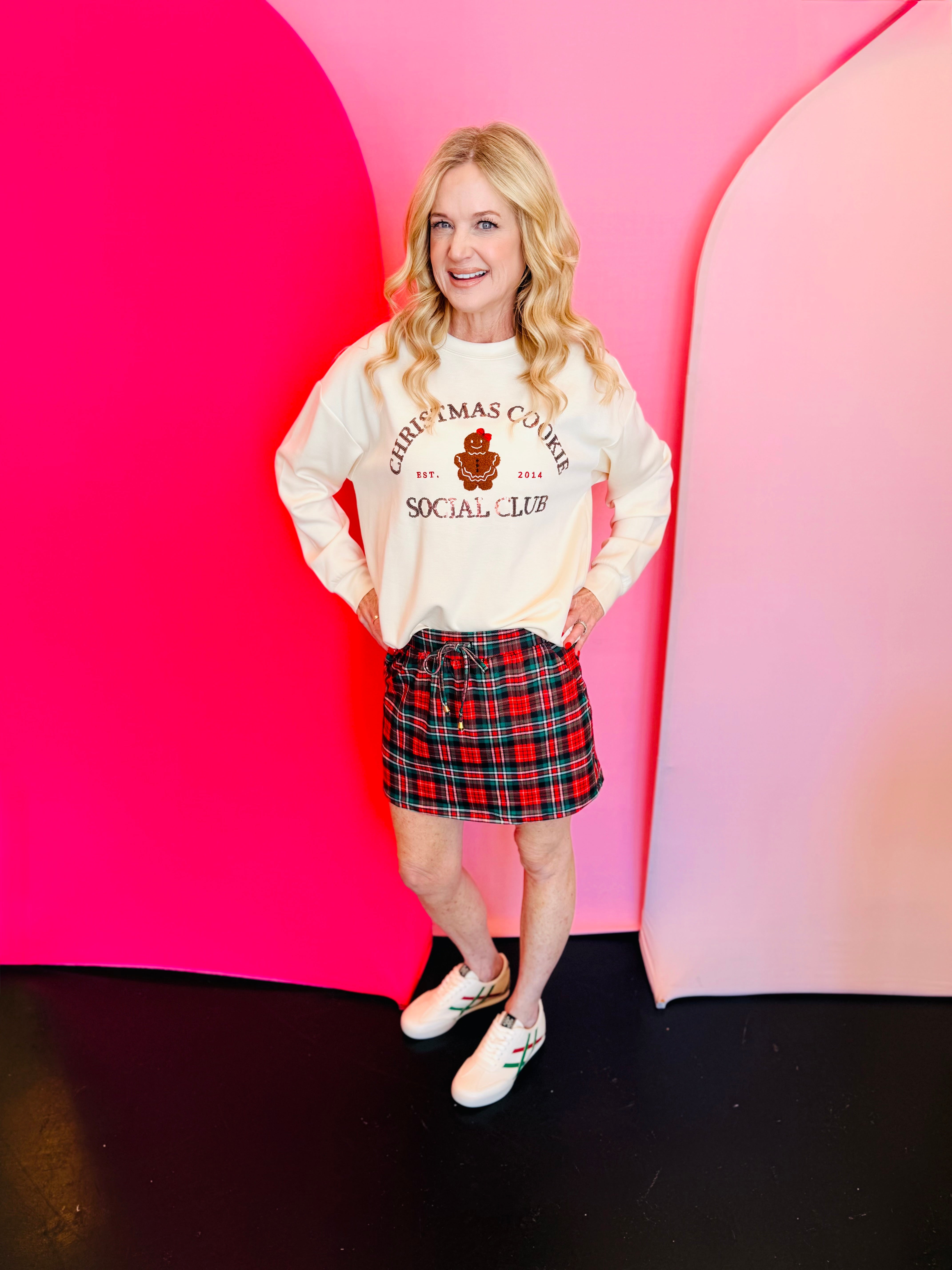 Red tartan Christmas skort with drawstring waist, pockets, and built-in shorts.