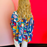 Back view of the blouse displaying the pinched detail at the upper back and the relaxed silhouette of the lightweight fabric.