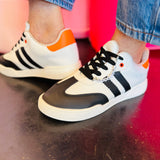 Game day sneakers with round toe, colorful accents, and removable team spirit charms