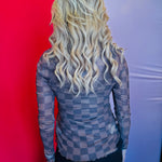 Back view of the Keigan Mesh Top showcasing the playful chocolate checkered print, sheer lightweight mesh fabric, and stylish lettuce-edge hem, offering a bold and breathable statement piece perfect for layering.