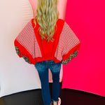 Back side of Red, stripe, and leopard oversized Dolman style long sleeve sweatshirt.