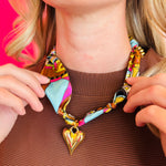 Brown & turquoise multi print silk scarf with large gold puffy heart charm