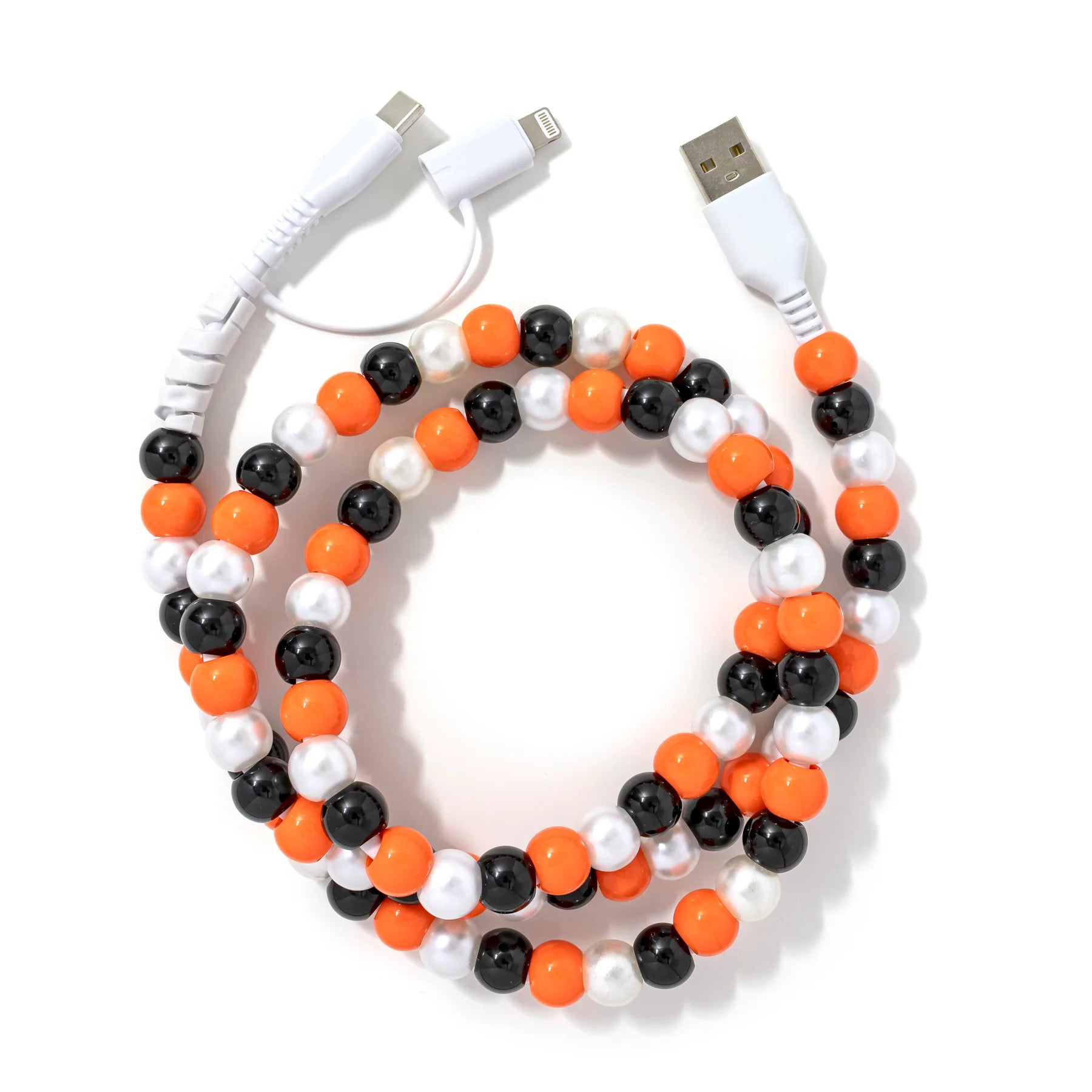 A vibrant orange, black, and pearl beaded phone charger cable.