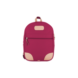 Jon Hart berry coated canvas backpack with Natural Leather trim, front zip pocket, two side pockets, and adjustable leather-detailed straps.