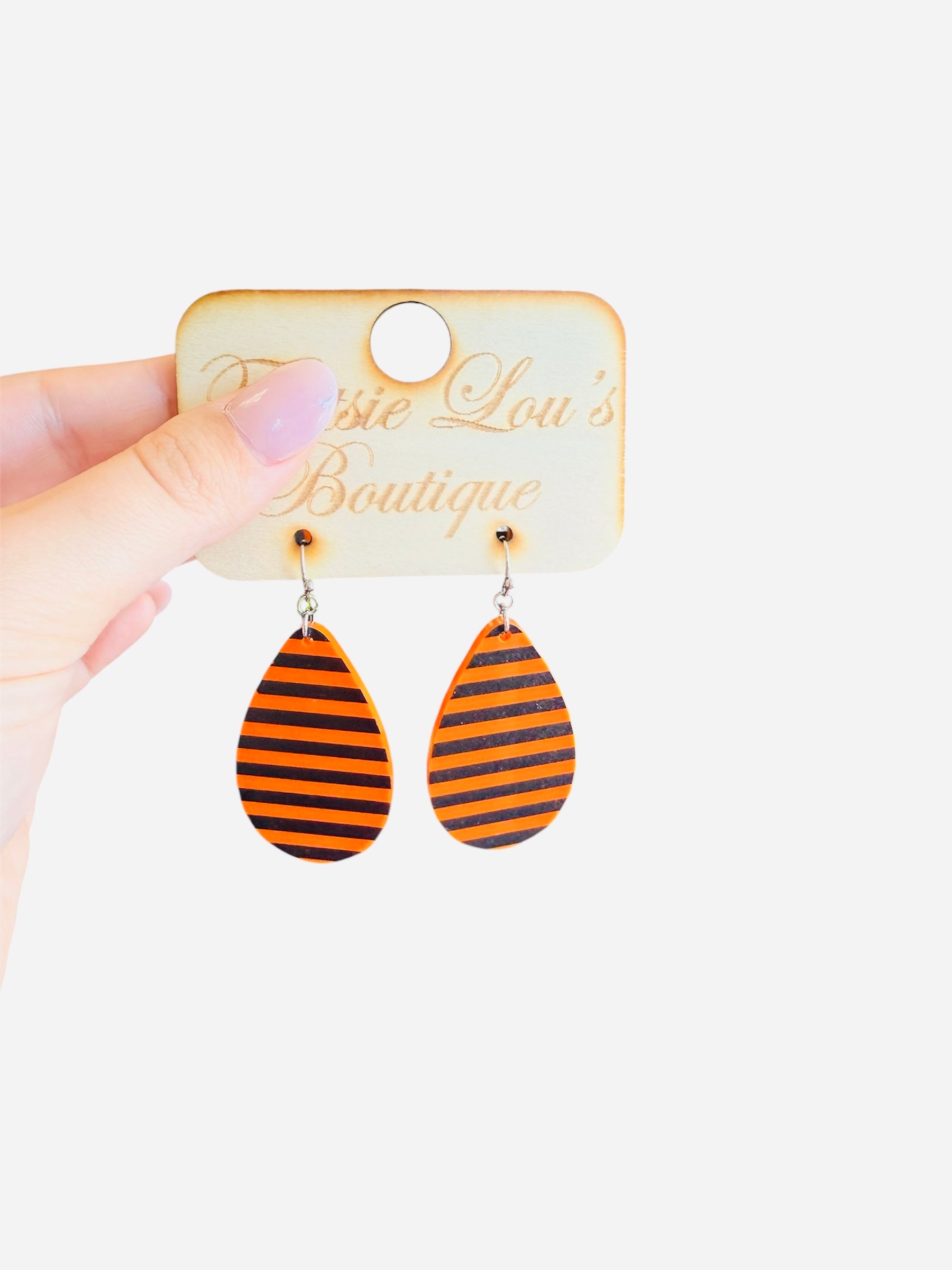 Teardrop earrings with black and orange horizontal stripes.