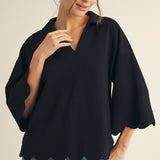 Black scalloped V-neck top with collar and 3/4 sleeves, made from soft, lightweight stretch fabric.