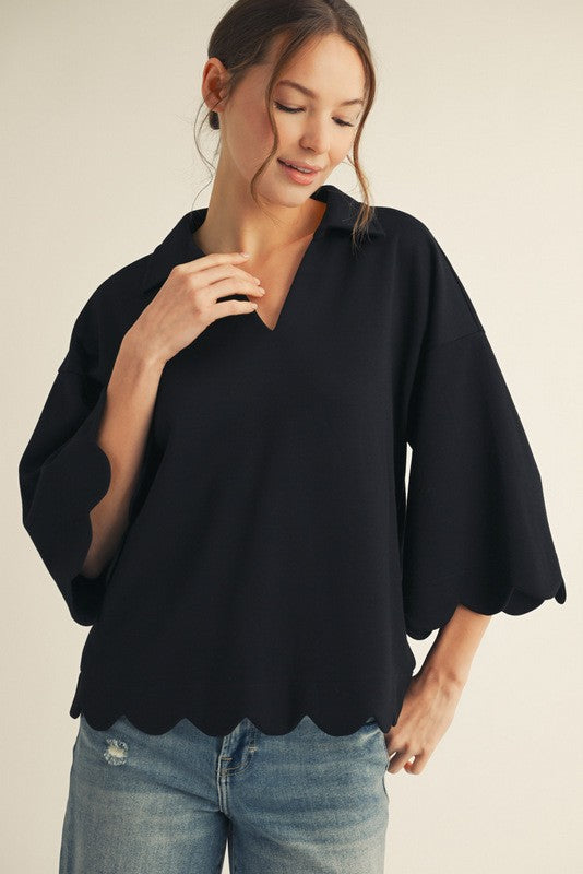 Black scalloped V-neck top with collar and 3/4 sleeves, made from soft, lightweight stretch fabric.