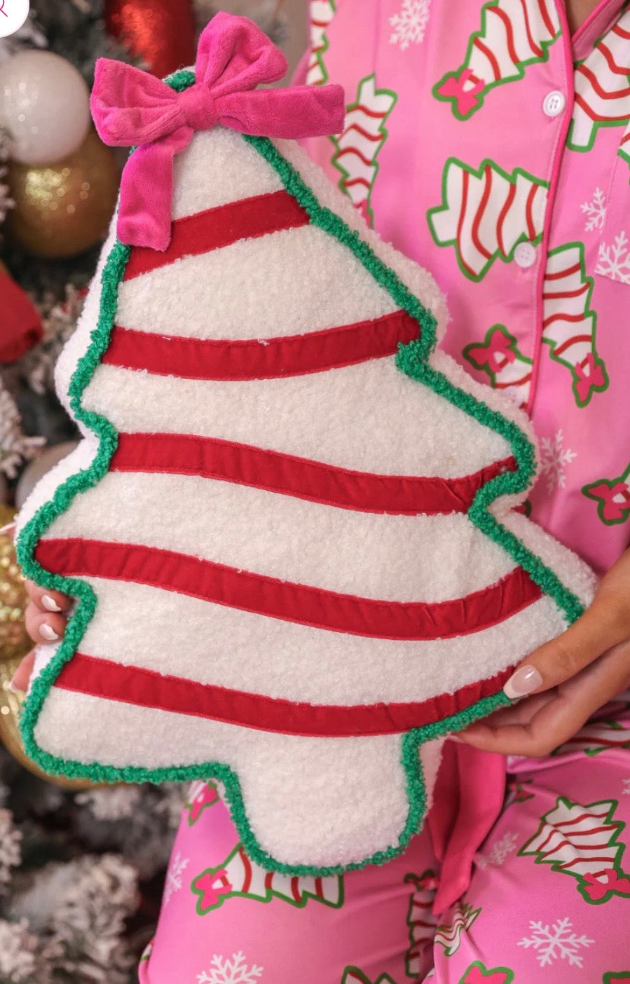 Pink bow Christmas treat pillow for festive home decor.
