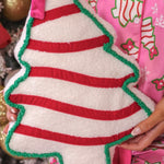 Pink bow Christmas treat pillow for festive home decor.