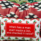 Red holiday needlepoint pillow with quote and festive holly border.