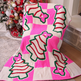 Pink checkered blanket with Christmas treats and pink bow design.