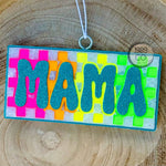 Checkered Rainbow Mama car freshie with blue glitter lettering and border on colorful checkered background.
