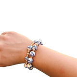 Two-piece Chinoiserie bracelet stack with gold accents and mixed bead sizes.