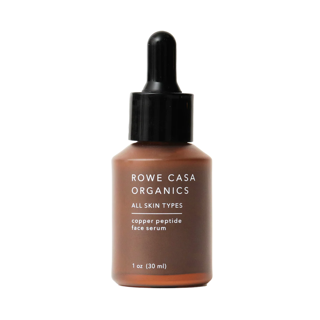 A bottle of Rowe Casa Organics Copper Peptide Face Serum with a dropper, labeled for all skin types.