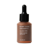 A bottle of Rowe Casa Organics Copper Peptide Face Serum with a dropper, labeled for all skin types.