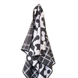 Crae 8 Track reversible microfiber hand towel, 19x29 in, daisy checkerboard front and black grid back.