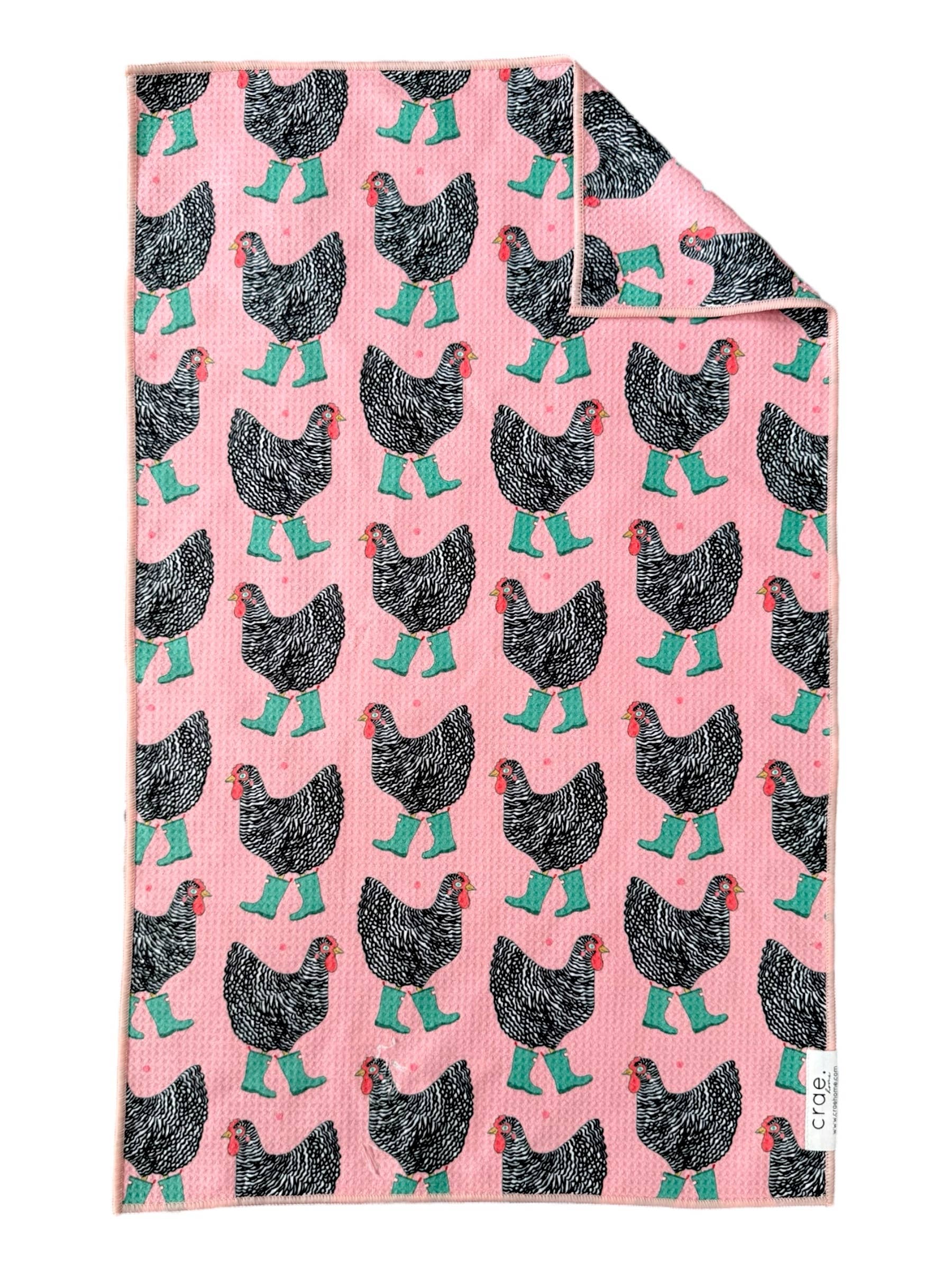 Crae Chick In Boots microfiber hand towel, 17x27 in, pink with chickens wearing teal boots.