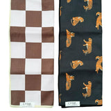 Crae Chocolate Check and Here Kitty Kitty towel set with checkerboard and bold tiger print designs.